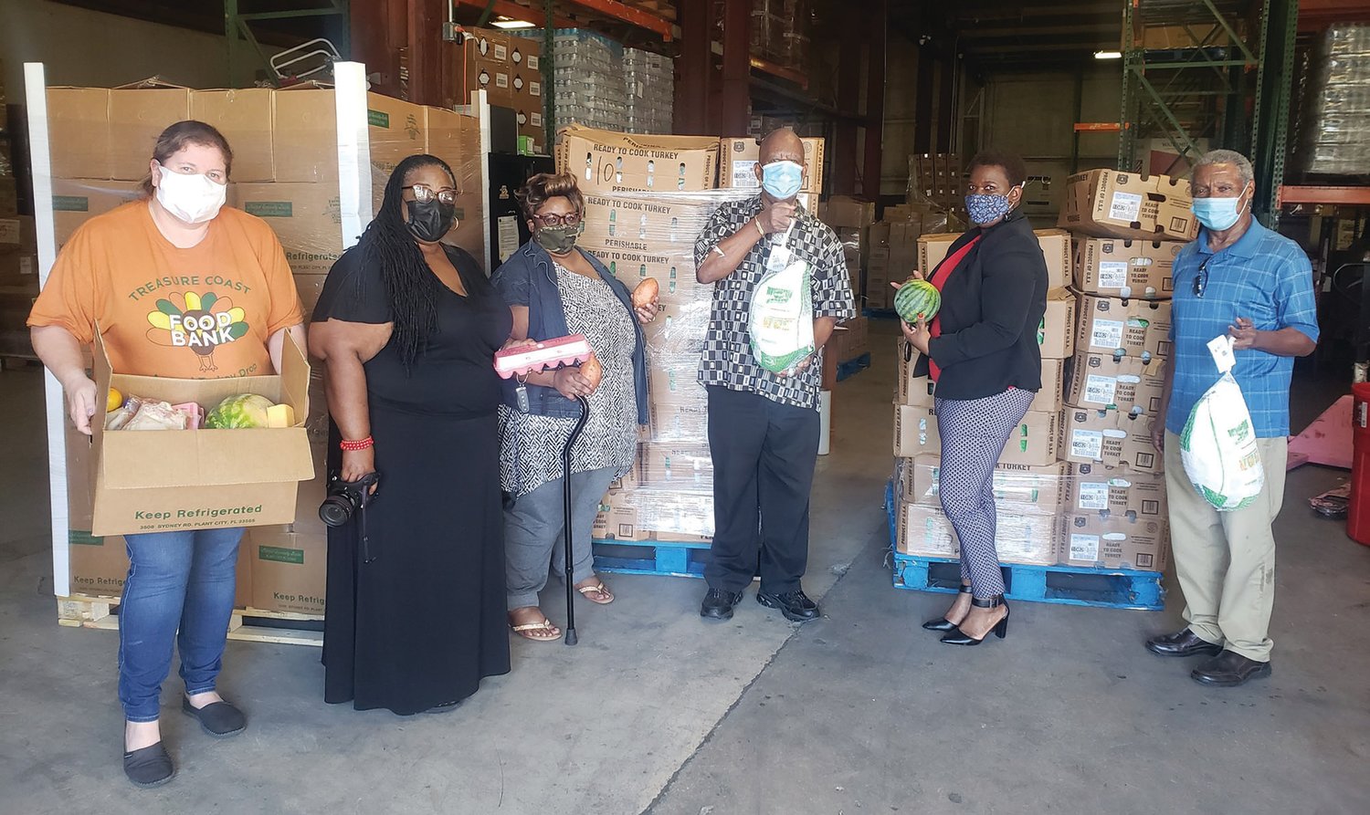 Pictured are: Erin Cox, Chief Operations Officer at Treasure Coast Food Bank; Michelle Irons, Caribbean American Cultural Group Assistant Secretary; Fiona Williams, Vice President and Co-Chair of the Benevolence Committee; Karl Godfrey; Dawn Bloomfield, President; and Neville Lake, Past President.